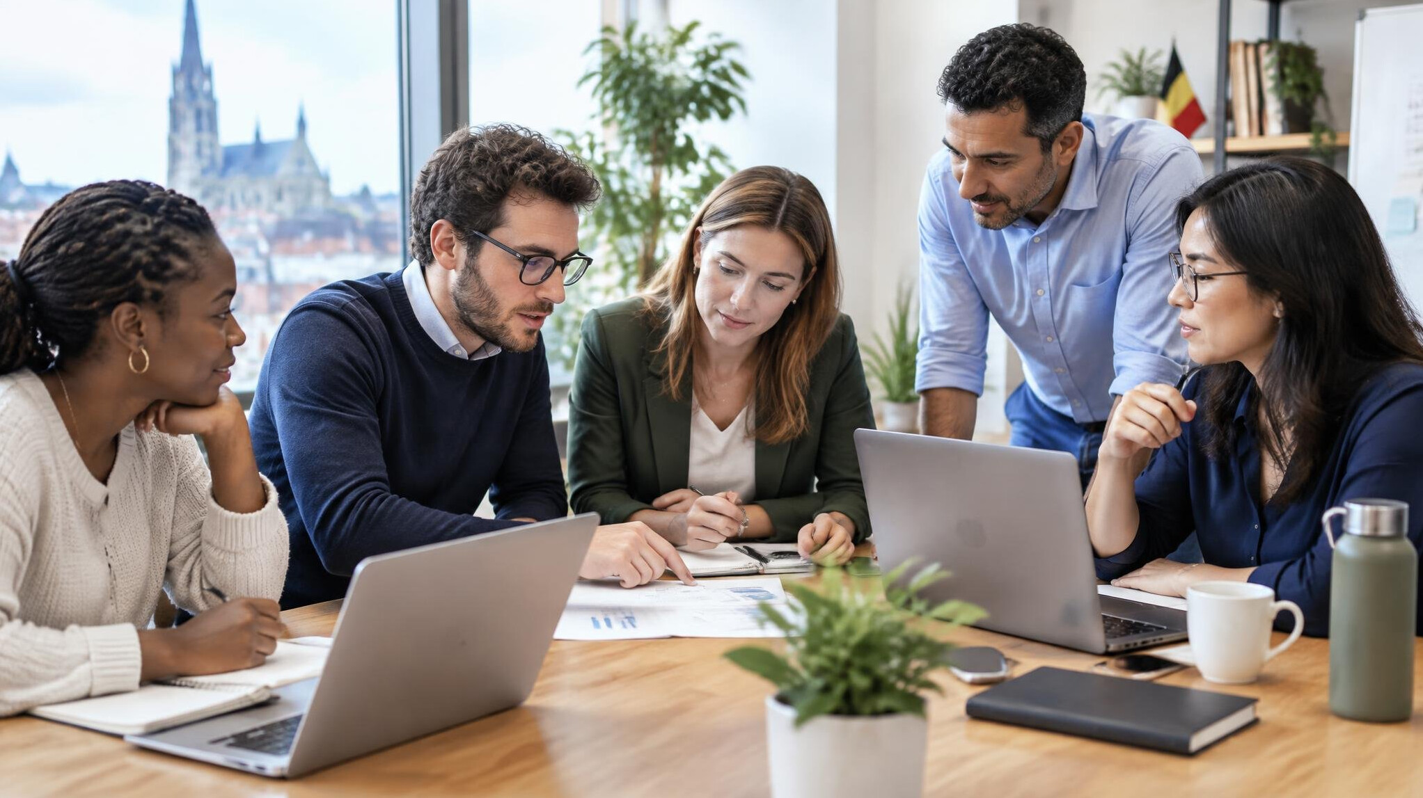 Team collaborating around a table in a modern office